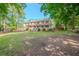 Two story house with wrap-around porch and large lawn at 3060 Orchard Sw Rd, Conyers, GA 30094