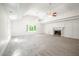 Spacious living room featuring a fireplace and high ceilings at 3060 Orchard Sw Rd, Conyers, GA 30094