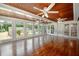 Sunroom with hardwood floors and access to backyard at 3060 Orchard Sw Rd, Conyers, GA 30094