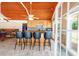 Pool house kitchen with granite island and wood cabinets at 3060 Orchard Sw Rd, Conyers, GA 30094