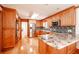 Kitchen features granite countertops and wood cabinets at 3060 Orchard Sw Rd, Conyers, GA 30094