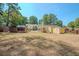 Spacious backyard with chicken coop and storage shed at 3060 Orchard Sw Rd, Conyers, GA 30094
