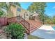 Elevated deck with stairs leading to the pool and backyard at 3060 Orchard Sw Rd, Conyers, GA 30094