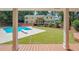 View of the home's back and pool through a covered porch at 3060 Orchard Sw Rd, Conyers, GA 30094
