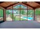View from screened porch showcasing backyard pool and landscape at 3060 Orchard Sw Rd, Conyers, GA 30094