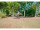Two story house partially obscured by trees on large lot at 3060 Orchard Sw Rd, Conyers, GA 30094