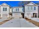 Three-unit townhouse building with attached garages at 6202 Ripple Way # 88, South Fulton, GA 30349