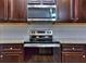 Modern kitchen with stainless steel appliances and granite countertops at 6202 Ripple Way # 88, South Fulton, GA 30349