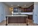 Modern kitchen with island, granite countertops, and stainless steel appliances at 6202 Ripple Way # 88, South Fulton, GA 30349