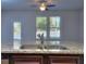 Kitchen island with granite countertop and double sink at 6202 Ripple Way # 88, South Fulton, GA 30349
