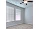 Bright bedroom with neutral walls, ceiling fan and carpet flooring at 6202 Ripple Way # 88, South Fulton, GA 30349