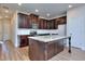 Modern kitchen with island, granite countertops, and stainless steel appliances at 6202 Ripple Way # 88, South Fulton, GA 30349