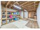 Unfinished basement area with shelving for storage at 160 Country Mill Ln, Stockbridge, GA 30281