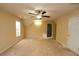 Bright bedroom featuring a ceiling fan and neutral decor at 994 Rolling Forest Ln, Lilburn, GA 30047