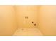 Laundry room with hookups and shelving at 994 Rolling Forest Ln, Lilburn, GA 30047