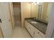 Bathroom with granite countertop and shower at 994 Rolling Forest Ln, Lilburn, GA 30047