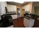 Eat-in kitchen with island, granite countertops, and stainless steel appliances at 994 Rolling Forest Ln, Lilburn, GA 30047