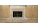 Beautiful marble fireplace with a white mantel, adding warmth and style at 994 Rolling Forest Ln, Lilburn, GA 30047