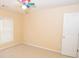 Bright bedroom with ceiling fan and neutral wall color at 994 Rolling Forest Ln, Lilburn, GA 30047