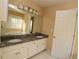 Double vanity bathroom with granite countertops at 994 Rolling Forest Ln, Lilburn, GA 30047