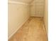 Large walk-in closet with wire shelving and ample hanging space at 994 Rolling Forest Ln, Lilburn, GA 30047
