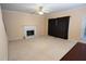 Living room with carpeted floors, fireplace and sliding glass doors at 994 Rolling Forest Ln, Lilburn, GA 30047