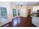 Kitchen with hardwood floors, an island, and stainless steel appliances at 994 Rolling Forest Ln, Lilburn, GA 30047