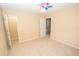 Spacious bedroom with ceiling fan and walk-in closet at 994 Rolling Forest Ln, Lilburn, GA 30047