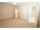 Spacious bedroom with carpet, ceiling fan and access to bathroom at 994 Rolling Forest Ln, Lilburn, GA 30047