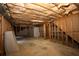 Unfinished basement with ample space for expansion and storage at 994 Rolling Forest Ln, Lilburn, GA 30047