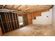 Unfinished basement with window and exposed framing at 994 Rolling Forest Ln, Lilburn, GA 30047