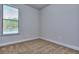 Bright bedroom featuring carpeted floor and large window at 6206 Ripple Way # 89, South Fulton, GA 30349