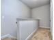 Upstairs hallway with neutral colored walls and carpeted floor at 6206 Ripple Way # 89, South Fulton, GA 30349