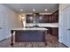 Modern kitchen with granite countertops, dark wood cabinets, and stainless steel appliances at 6206 Ripple Way # 89, South Fulton, GA 30349