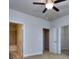 Primary bedroom with carpet, ceiling fan, and doors to bathroom and closet at 6206 Ripple Way # 89, South Fulton, GA 30349