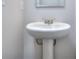 A pedestal sink in a small bathroom at 6210 Ripple Way # 90, South Fulton, GA 30349