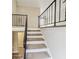 Carpeted staircase with metal railing leading to the upper level at 2900 Bradmoor Ct, Decatur, GA 30034