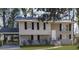 Two-story house with a carport and landscaped lawn at 2900 Bradmoor Ct, Decatur, GA 30034