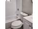Clean bathroom with white tiled walls and a white toilet and bathtub at 2900 Bradmoor Ct, Decatur, GA 30034