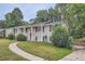 Brick ranch house with red door and landscaping at 3993 Snapfinger Way, Decatur, GA 30035