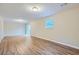 Finished basement with wood-look flooring and sliding door access to patio at 3993 Snapfinger Way, Decatur, GA 30035