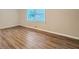 Bright bedroom featuring hardwood floors and a large window at 3993 Snapfinger Way, Decatur, GA 30035