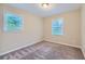 Cozy bedroom with neutral carpeting and two windows at 3993 Snapfinger Way, Decatur, GA 30035