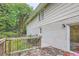 Home features a deck overlooking a spacious backyard with mature trees at 3993 Snapfinger Way, Decatur, GA 30035