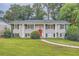 Brick ranch house with red door and landscaping at 3993 Snapfinger Way, Decatur, GA 30035