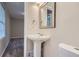 Small half bathroom with pedestal sink and toilet at 3993 Snapfinger Way, Decatur, GA 30035