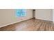 Spacious bedroom with hardwood floors and a large window at 3993 Snapfinger Way, Decatur, GA 30035