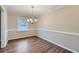 Charming dining room with hardwood floors and elegant chair rail at 3993 Snapfinger Way, Decatur, GA 30035