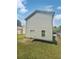 House exterior showcasing a light-colored siding and a well-maintained lawn at 1094 Amberglade Way, Douglasville, GA 30134