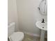 Simple half bathroom with pedestal sink and updated toilet at 1094 Amberglade Way, Douglasville, GA 30134